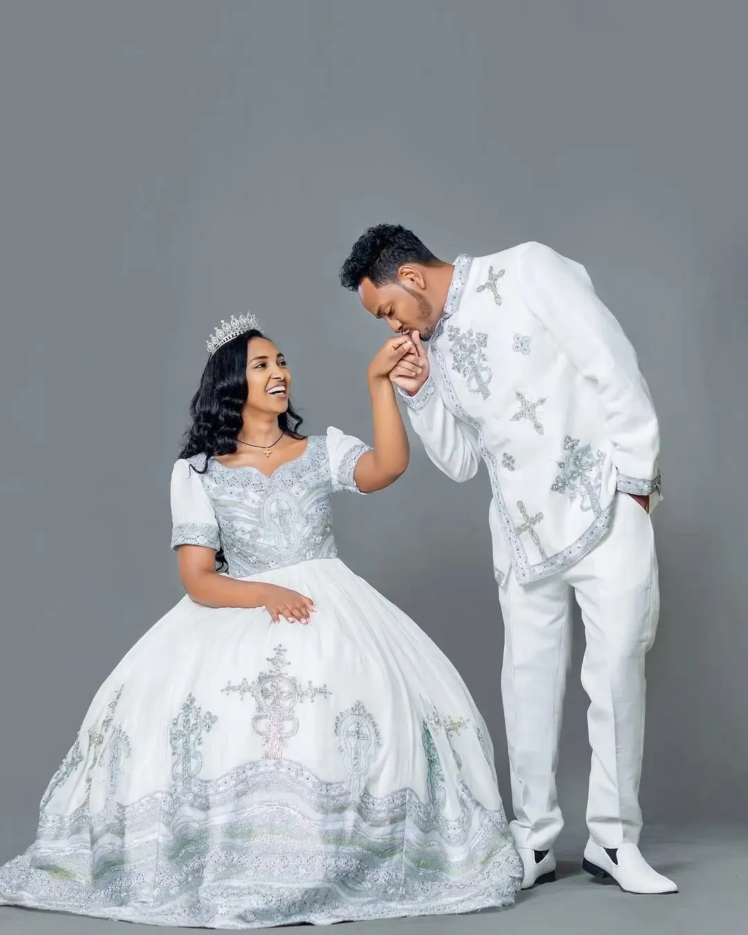 Sophisticated Silver and Blue Habesha Couple's Outfit: Modern Matching Ethiopian Wedding Attire